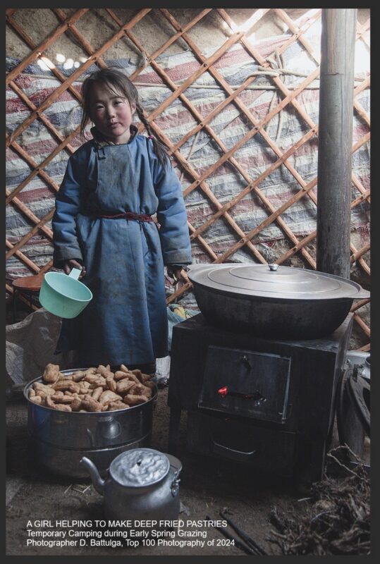 A nomadic girl is helping to make deep fried pastries during the early spring grazing camp
